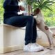 trainer shares food with a Jack Russell Terrier